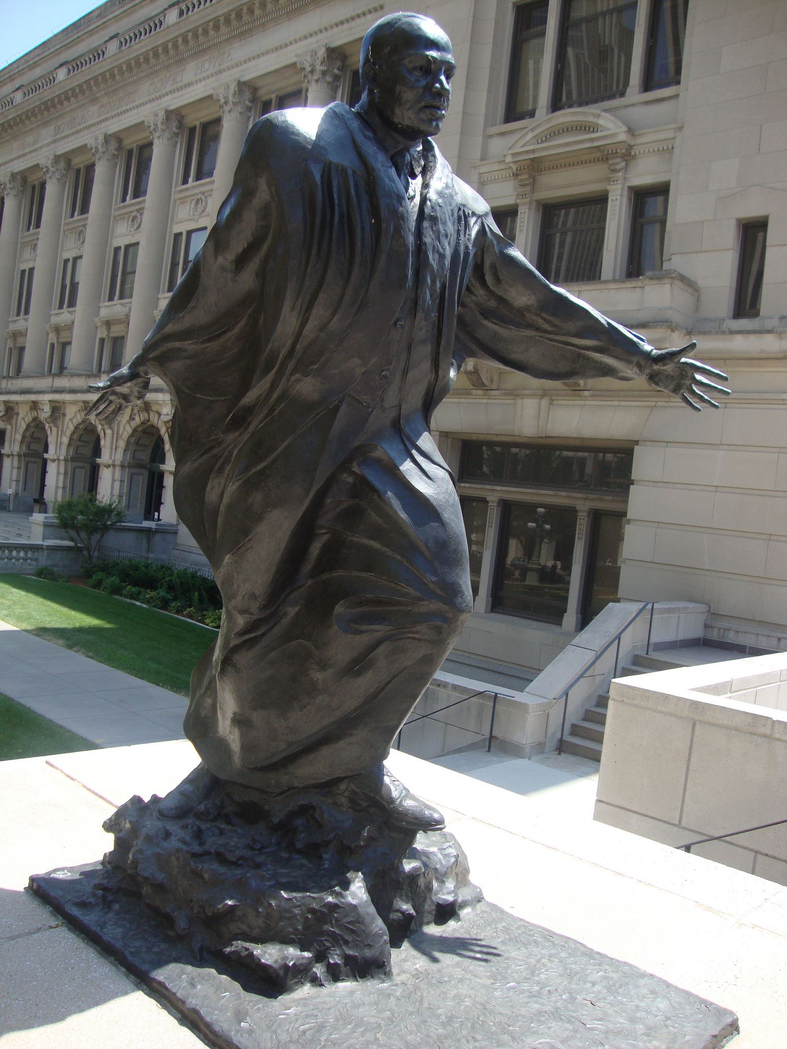 Sculpture of a man in a robe with arms outstretched Sculpture of a man in a robe with arms outstretched